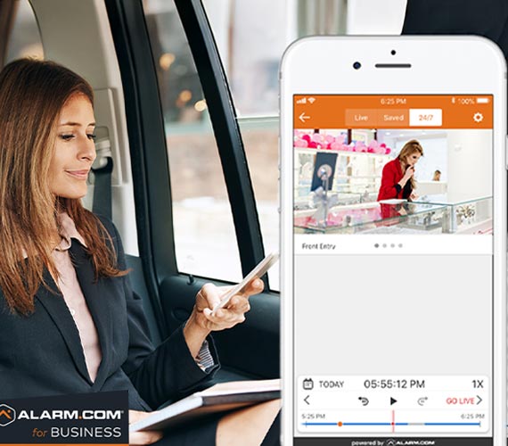 A person monitoring their business remotely from inside a vehicle A person monitoring their business remotely from inside a vehicle
