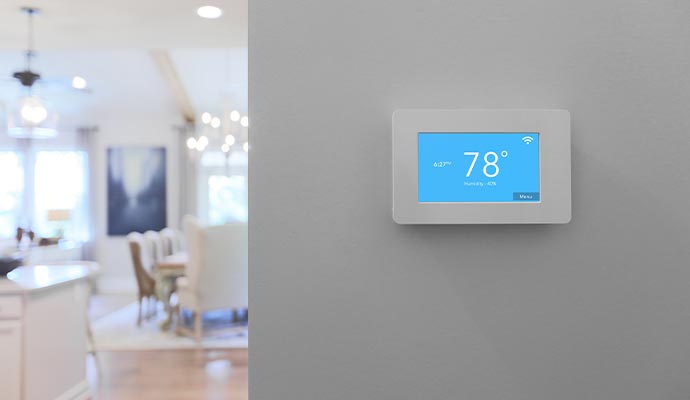 Installed smart thermostat on the wall Installed smart thermostat on the wall