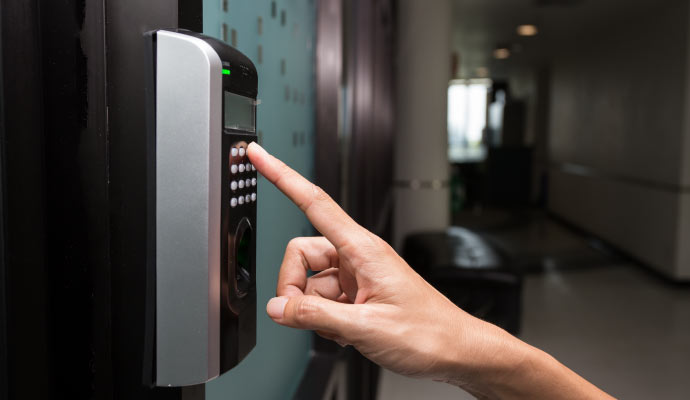 A person using pin based access control system