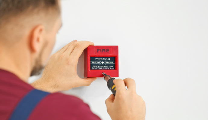 professional person installing fire alarm