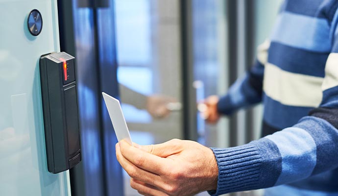 a person scanning their access card on a role based access control system