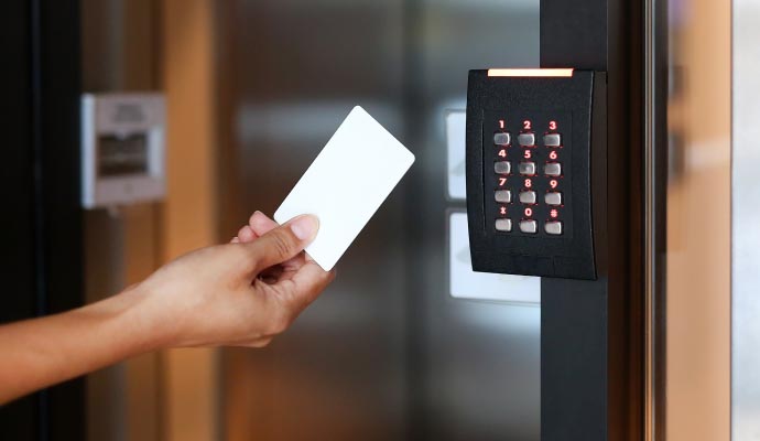 a person using a touchless door system