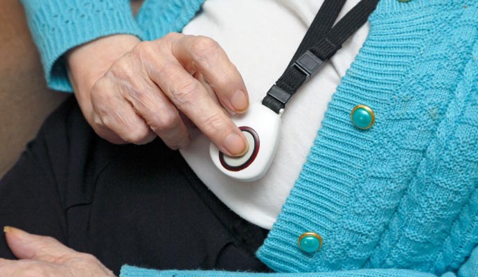 an old person using medical pendant