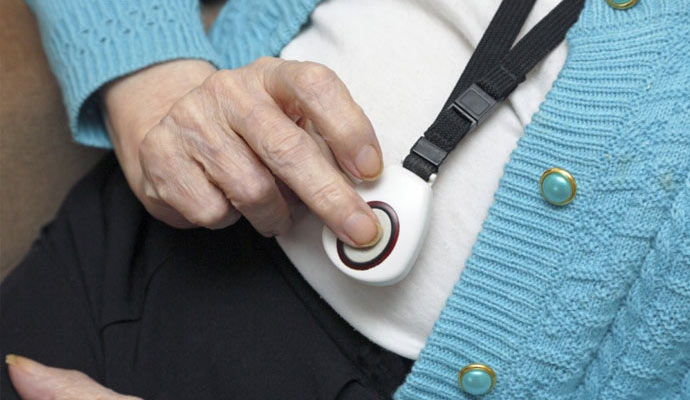 An elderly person using medical alert system