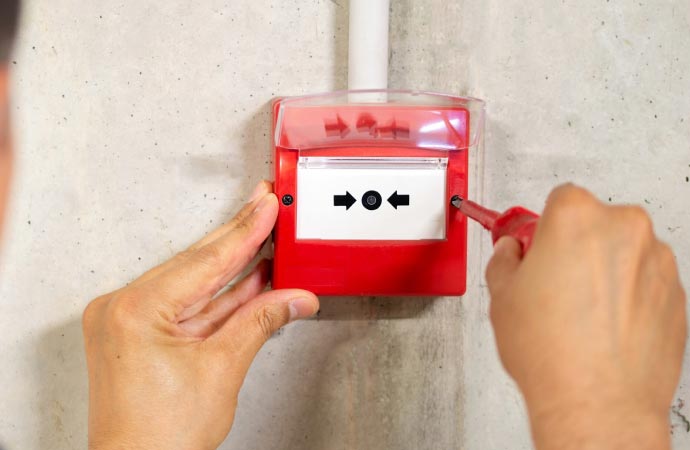 Worker mounting fire alarm system for enhanced workplace safety